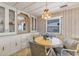 Bright dining area with built-in hutch and wood flooring at 1523 46Th E Ave, Ellenton, FL 34222
