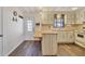 Galley style kitchen with light wood cabinets at 1523 46Th E Ave, Ellenton, FL 34222