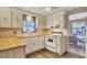 White appliances and light wood cabinets at 1523 46Th E Ave, Ellenton, FL 34222
