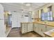 Kitchen with white cabinets and wood countertops at 1523 46Th E Ave, Ellenton, FL 34222