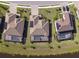 Three homes with pools and solar panels, overlooking a canal at 17539 Polo Trl, Bradenton, FL 34211