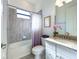 Clean bathroom with tub shower combo, granite vanity, and updated fixtures at 17539 Polo Trl, Bradenton, FL 34211
