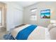 Well-lit bedroom with ample closet space and calming decor at 17539 Polo Trl, Bradenton, FL 34211