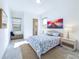 Bright bedroom with ensuite bathroom and large window at 17539 Polo Trl, Bradenton, FL 34211