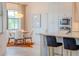 Cozy breakfast nook with a round table and chairs, near the kitchen at 17539 Polo Trl, Bradenton, FL 34211