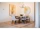 Elegant dining room with a wood table, chandelier, and area rug at 17539 Polo Trl, Bradenton, FL 34211