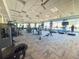 State-of-the-art fitness center with various equipment and large windows at 17539 Polo Trl, Bradenton, FL 34211
