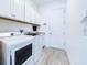 Convenient laundry room with washer, dryer, and ample storage at 17539 Polo Trl, Bradenton, FL 34211
