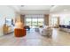 Bright and airy living room with large windows and stylish furnishings at 17539 Polo Trl, Bradenton, FL 34211