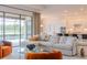 Open-concept living room with a view of the pool and kitchen at 17539 Polo Trl, Bradenton, FL 34211
