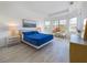 Spacious main bedroom with a large bed and ample natural light at 17539 Polo Trl, Bradenton, FL 34211