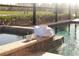 Relaxing pool and spa with towels and coffee, ready for guests at 17539 Polo Trl, Bradenton, FL 34211