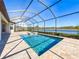Relaxing screened pool and spa with lake view at 17539 Polo Trl, Bradenton, FL 34211