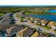 Aerial view of a residential community with lakefront properties at 20861 Cattail Blvd, Venice, FL 34292