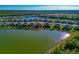 House nestled in a community near a lake with lush greenery at 20861 Cattail Blvd, Venice, FL 34292