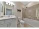Bathroom with tub, shower, vanity, and a framed mirror at 20861 Cattail Blvd, Venice, FL 34292