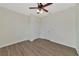 Spacious bedroom with wood-look floors and a double door closet at 20861 Cattail Blvd, Venice, FL 34292