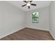 Spacious bedroom featuring a ceiling fan and large window with blinds at 20861 Cattail Blvd, Venice, FL 34292