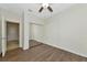Bright bedroom with mirrored closet doors and wood-look flooring at 20861 Cattail Blvd, Venice, FL 34292