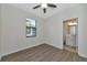 Comfortable bedroom with ceiling fan and en-suite bathroom access at 20861 Cattail Blvd, Venice, FL 34292