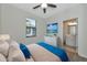 Main bedroom with ensuite bathroom and large TV at 20861 Cattail Blvd, Venice, FL 34292