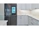 Modern kitchen with white cabinets, quartz counters and appliances at 20861 Cattail Blvd, Venice, FL 34292