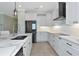 Modern kitchen with white cabinets, quartz counters, and island at 20861 Cattail Blvd, Venice, FL 34292