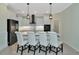 Modern kitchen with white cabinets, quartz counters, and island at 20861 Cattail Blvd, Venice, FL 34292