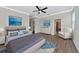 Large main bedroom with ceiling fan and en-suite bathroom at 20861 Cattail Blvd, Venice, FL 34292