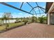 Covered patio overlooking a lake with paver stones at 20861 Cattail Blvd, Venice, FL 34292
