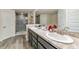 Elegant bathroom featuring double sinks and a walk-in shower at 2155 Jagust Rd, North Port, FL 34288