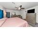 Spacious main bedroom with plush bedding and a ceiling fan at 2155 Jagust Rd, North Port, FL 34288