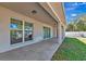 Covered patio with sliding glass doors and backyard access at 2155 Jagust Rd, North Port, FL 34288