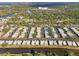 Community overview showcasing numerous homes and waterfront access at 2505 Riverbluff Pkwy # V196, Sarasota, FL 34231