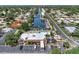 Aerial view of community pool, clubhouse, and parking at 2505 Riverbluff Pkwy # V196, Sarasota, FL 34231