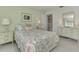 Light and airy bedroom with floral bedding and ample closet space at 2505 Riverbluff Pkwy # V196, Sarasota, FL 34231