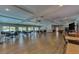 Spacious community room with tables, chairs, and a pool table at 2505 Riverbluff Pkwy # V196, Sarasota, FL 34231