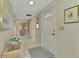 Hallway with view into living room and art at 2505 Riverbluff Pkwy # V196, Sarasota, FL 34231