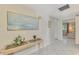 Bright entryway with console table and art at 2505 Riverbluff Pkwy # V196, Sarasota, FL 34231