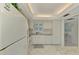 Clean kitchen with white cabinets, granite countertops, and Whirlpool appliances at 2505 Riverbluff Pkwy # V196, Sarasota, FL 34231