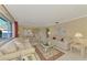 Open living room showcasing a view into the dining area and comfortable furnishings at 2505 Riverbluff Pkwy # V196, Sarasota, FL 34231