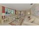 Living room with two sofas, a coffee table, and a view of the patio at 2505 Riverbluff Pkwy # V196, Sarasota, FL 34231