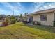 Private backyard with grassy area and screened patio at 2709 60Th Avenue N Plz # D, Bradenton, FL 34207