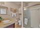 Bathroom with granite countertop and walk-in shower at 2709 60Th Avenue N Plz # D, Bradenton, FL 34207