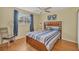 Bedroom with wood bed frame and blue striped bedding at 2709 60Th Avenue N Plz # D, Bradenton, FL 34207