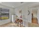Small kitchenette with white cabinets and two woven stools at 2709 60Th Avenue N Plz # D, Bradenton, FL 34207