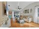 Living room with hardwood floors, comfortable seating, and a view to backyard at 2709 60Th Avenue N Plz # D, Bradenton, FL 34207