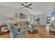 Open living room with hardwood floors, comfortable seating, and access to dining area at 2709 60Th Avenue N Plz # D, Bradenton, FL 34207