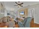 Bright and airy living room with hardwood floors, comfortable furniture, and a view to dining area at 2709 60Th Avenue N Plz # D, Bradenton, FL 34207