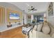Spacious living room with hardwood floors, comfy seating, and large TV at 2709 60Th Avenue N Plz # D, Bradenton, FL 34207